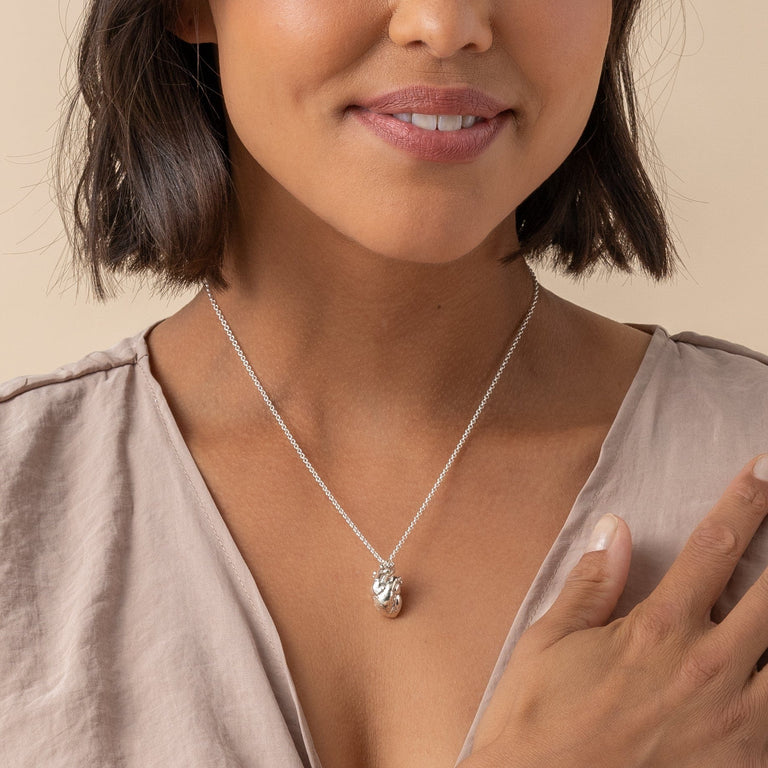 Anatomical Heart Necklace on a model, highlighting the pendant’s realistic anatomical details. Anatomical Heart Necklace on a model, highlighting the pendant’s realistic anatomical details.