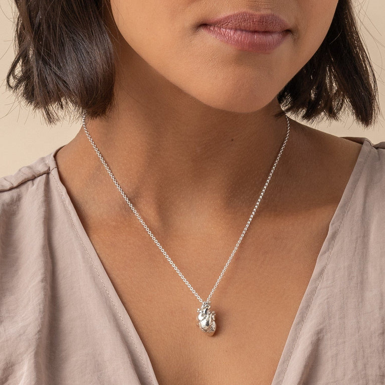 Side view of the Anatomical Heart Necklace, illustrating its three-dimensional design. Side view of the Anatomical Heart Necklace, illustrating its three-dimensional design.