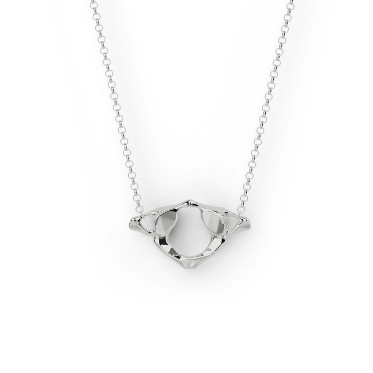 Close-up view of sterling silver Atlas Necklace featuring the anatomical Atlas bone design. Close-up view of sterling silver Atlas Necklace featuring the anatomical Atlas bone design.