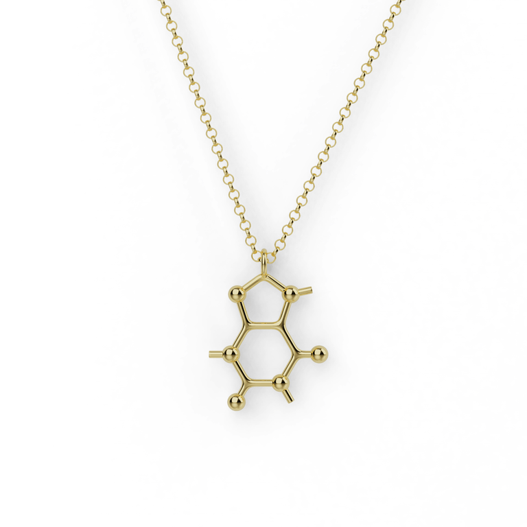 Gold vermeil caffeine necklace close-up – elegant, science-inspired jewelry for coffee enthusiasts. Gold vermeil caffeine necklace close-up – elegant, science-inspired jewelry for coffee enthusiasts.