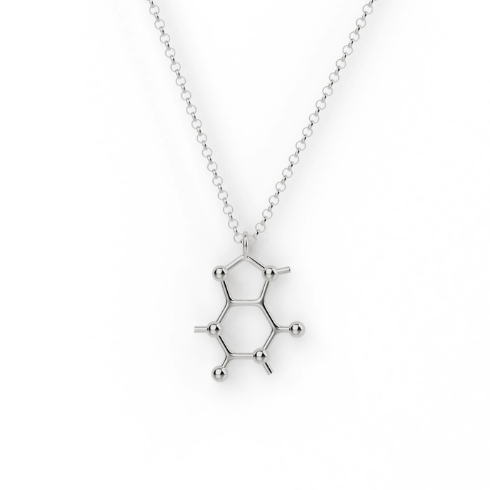 Close-up of a silver caffeine molecule necklace, showcasing its unique molecular design and sleek finish, perfect for science and coffee enthusiasts. Close-up of a silver caffeine molecule necklace, showcasing its unique molecular design and sleek finish, perfect for science and coffee enthusiasts.