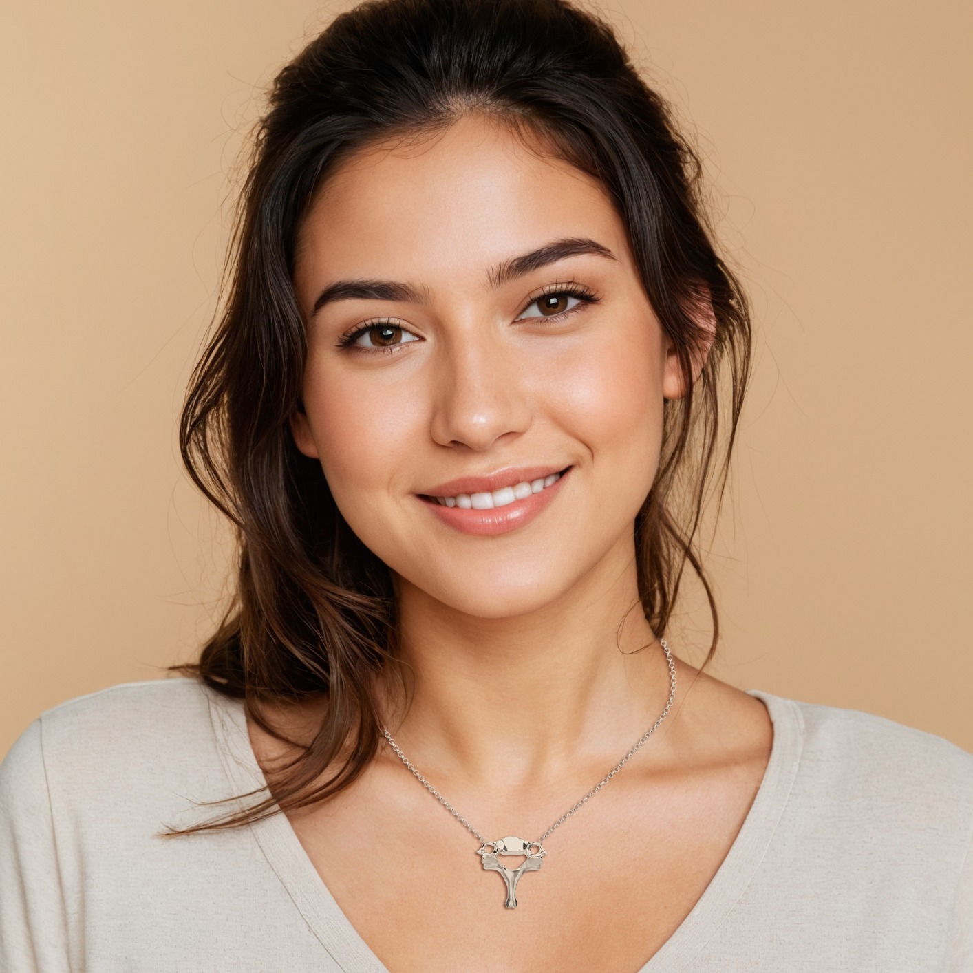 Woman wearing a silver cervical vertebra necklace - close-up view, emphasizing the scientific and stylish design of the jewelry. Woman wearing a silver cervical vertebra necklace - close-up view, emphasizing the scientific and stylish design of the jewelry.
