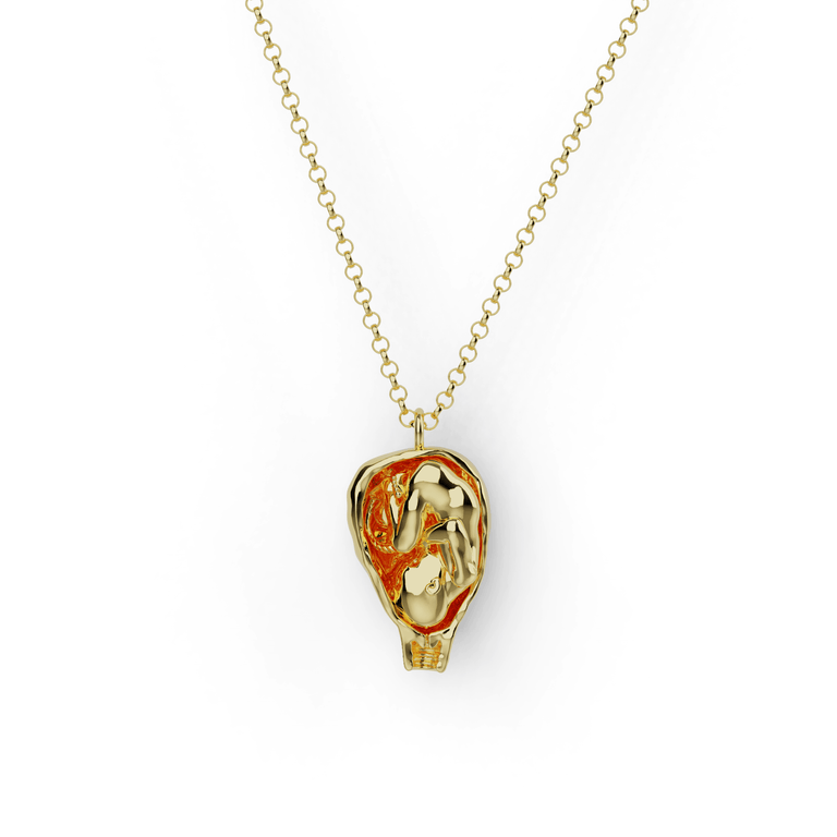 Gold vermeil fetus necklace, detailed anatomical pendant in gold plating. Gold vermeil fetus necklace, detailed anatomical pendant in gold plating.