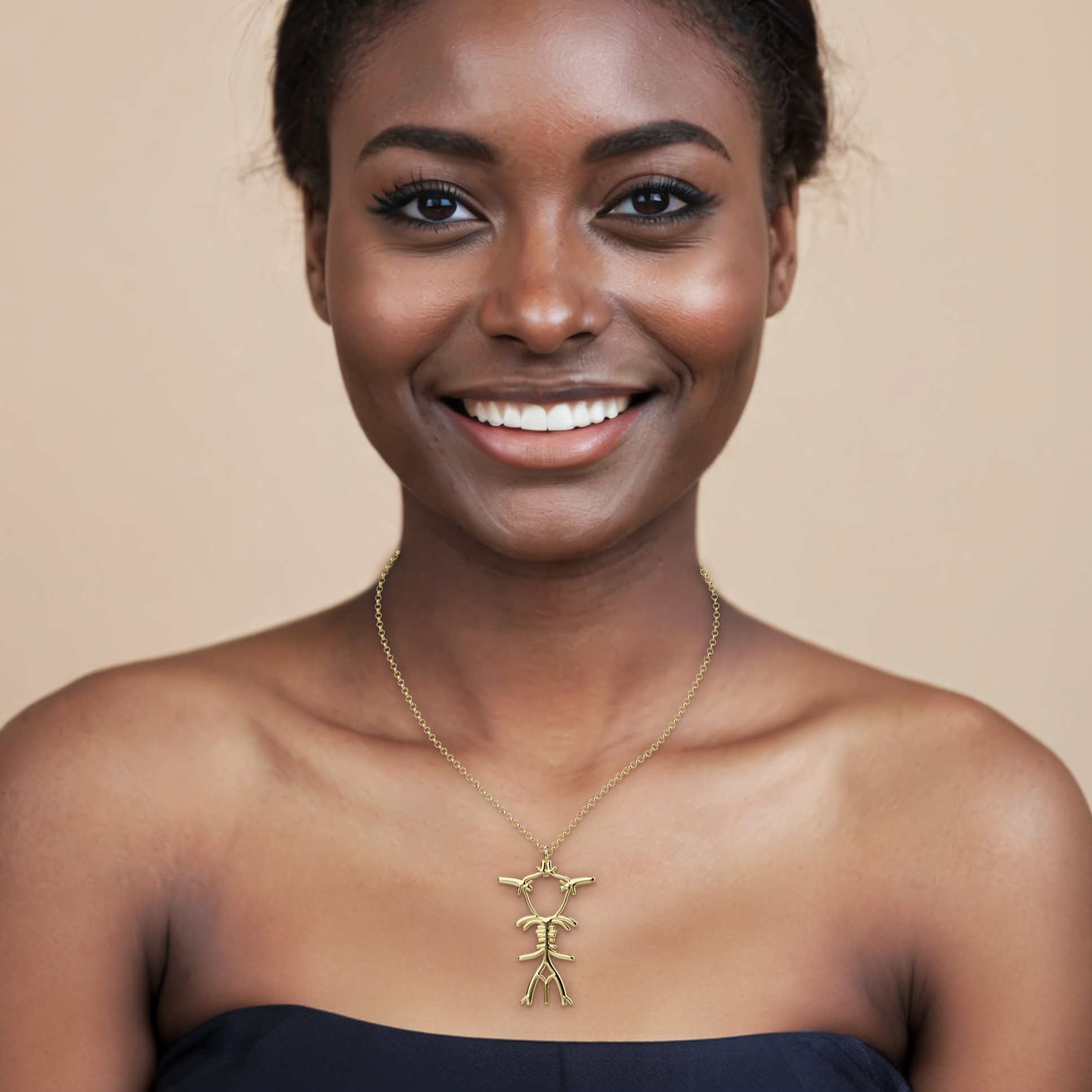 Model wearing the gold vermeil Circle of Willis Necklace, showcasing the brain-inspired piece that celebrates the network of blood vessels that keep us thinking. Model wearing the gold vermeil Circle of Willis Necklace, showcasing the brain-inspired piece that celebrates the network of blood vessels that keep us thinking.