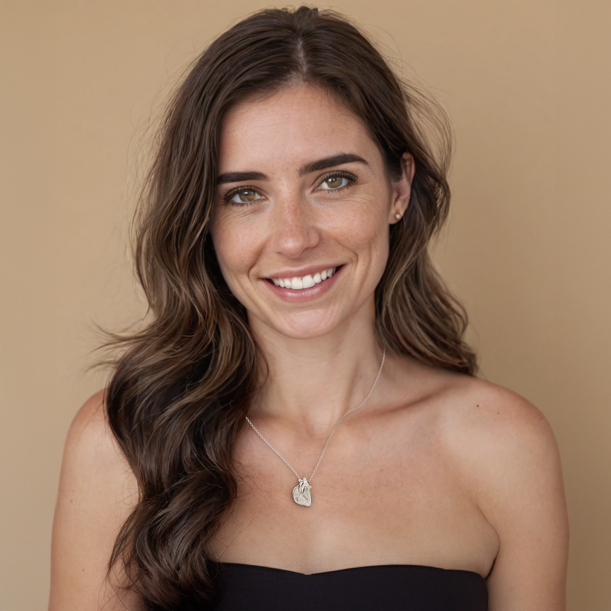 Model wearing a science-inspired heart section necklace, perfect for medical professionals and anatomy lovers. Model wearing a science-inspired heart section necklace, perfect for medical professionals and anatomy lovers.