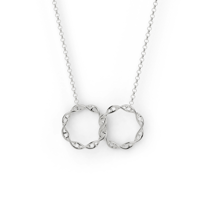 3D-printed interlocking DNA necklace in silver, featuring two intertwined DNA rings. 3D-printed interlocking DNA necklace in silver, featuring two intertwined DNA rings.