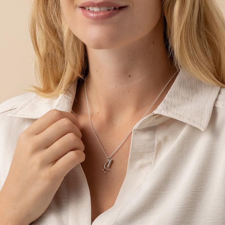 Detailed view of microscope pendant necklace in silver, ideal for science enthusiasts. Detailed view of microscope pendant necklace in silver, ideal for science enthusiasts.