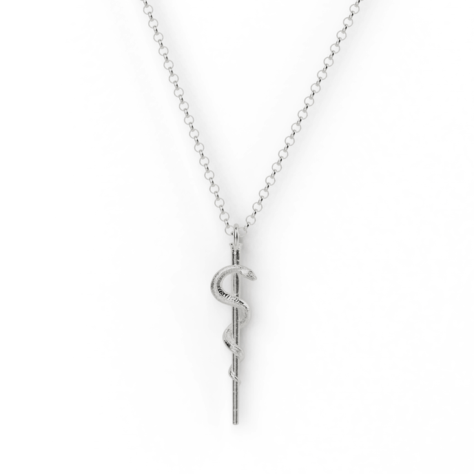 Sterling silver Rod of Asclepius necklace on display, featuring a detailed serpent design, symbolizing medicine and healing. Sterling silver Rod of Asclepius necklace on display, featuring a detailed serpent design, symbolizing medicine and healing.