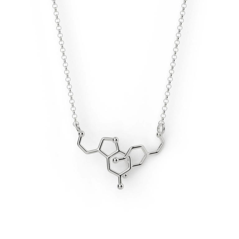 Dopamine and Serotonin Necklace in silver - close-up view showing interlocked molecular design. Dopamine and Serotonin Necklace in silver - close-up view showing interlocked molecular design.