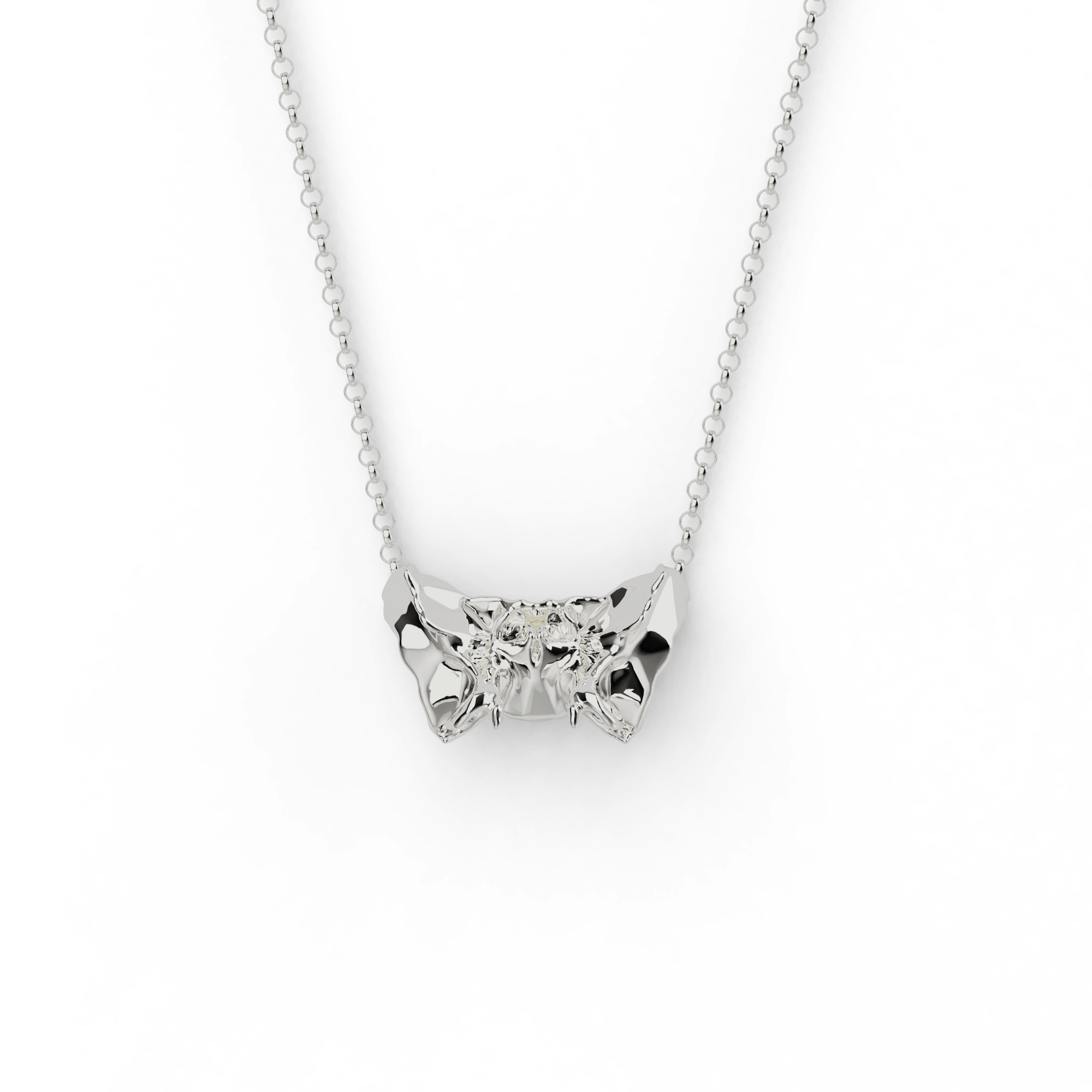 Close-up of the sphenoid bone necklace in sterling silver, showcasing its intricate butterfly-shaped design inspired by anatomy. Close-up of the sphenoid bone necklace in sterling silver, showcasing its intricate butterfly-shaped design inspired by anatomy.