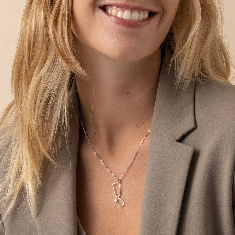 Silver Stethoscope Necklace, the perfect gift for medical professionals and healthcare enthusiasts. Silver Stethoscope Necklace, the perfect gift for medical professionals and healthcare enthusiasts.