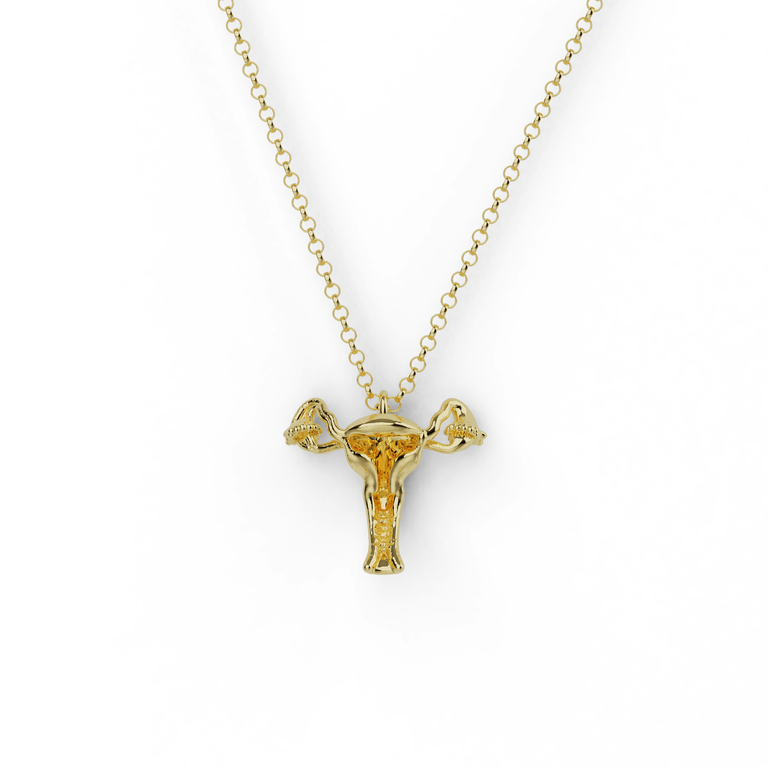 Gold vermeil uterus necklace featuring a detailed anatomical design, suspended from a delicate chain. A unique science-inspired jewelry piece. Gold vermeil uterus necklace featuring a detailed anatomical design, suspended from a delicate chain. A unique science-inspired jewelry piece.