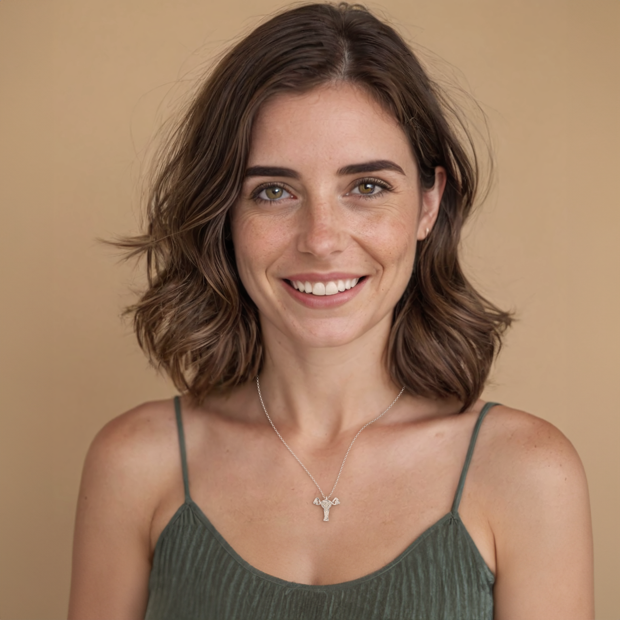 Model wearing a science-inspired uterus necklace, a statement piece for medical professionals and anatomy enthusiasts. Model wearing a science-inspired uterus necklace, a statement piece for medical professionals and anatomy enthusiasts.