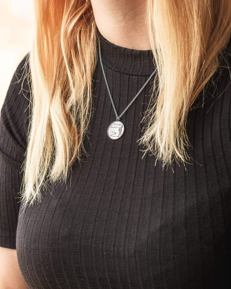Petri Dish Necklace in sterling silver, microbiology-inspired jewelry with intricate bacterial streaks, ideal for scientists and students. Petri Dish Necklace in sterling silver, microbiology-inspired jewelry with intricate bacterial streaks, ideal for scientists and students.