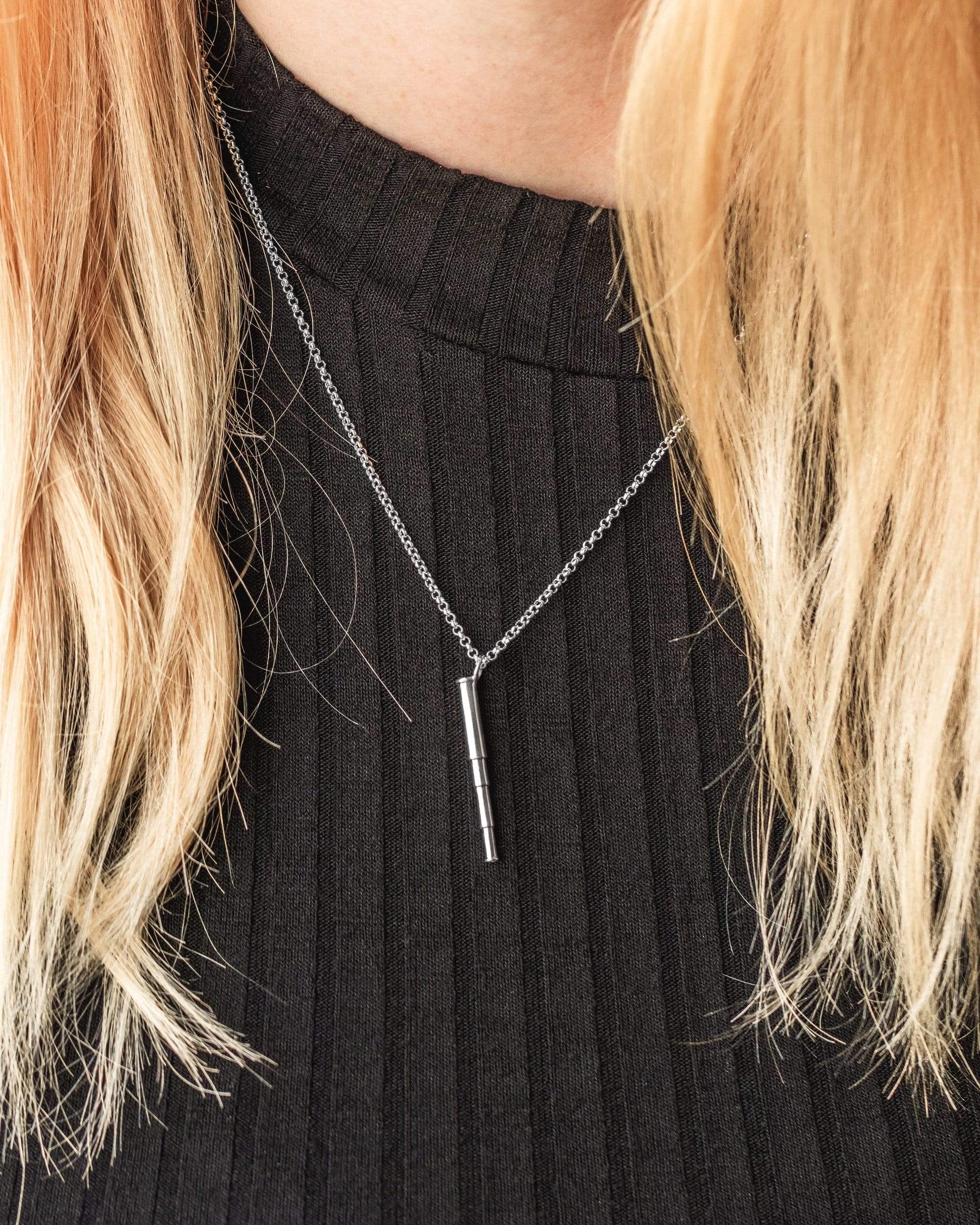 Close-up of a stylish telescope necklace worn around the neck, showcasing its elegant science-inspired design. Close-up of a stylish telescope necklace worn around the neck, showcasing its elegant science-inspired design.