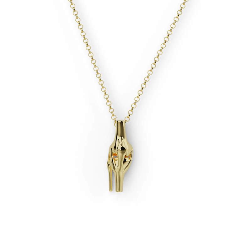 Gold vermeil knee necklace showing anatomical knee joint structure