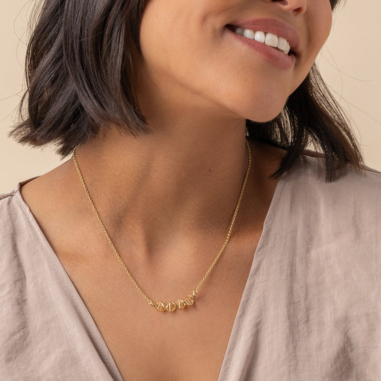 Gold DNA necklace in 18K vermeil on model, ideal for researchers and geneticists.