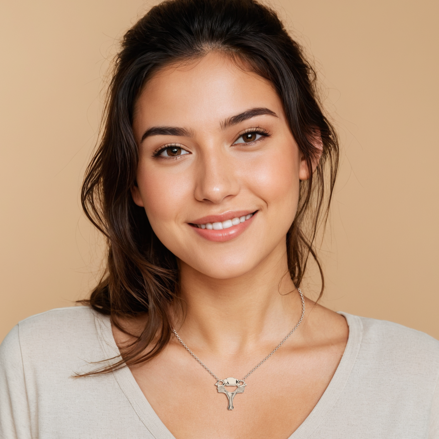 Woman wearing a silver cervical vertebra necklace - close-up view, emphasizing the scientific and stylish design of the jewelry.