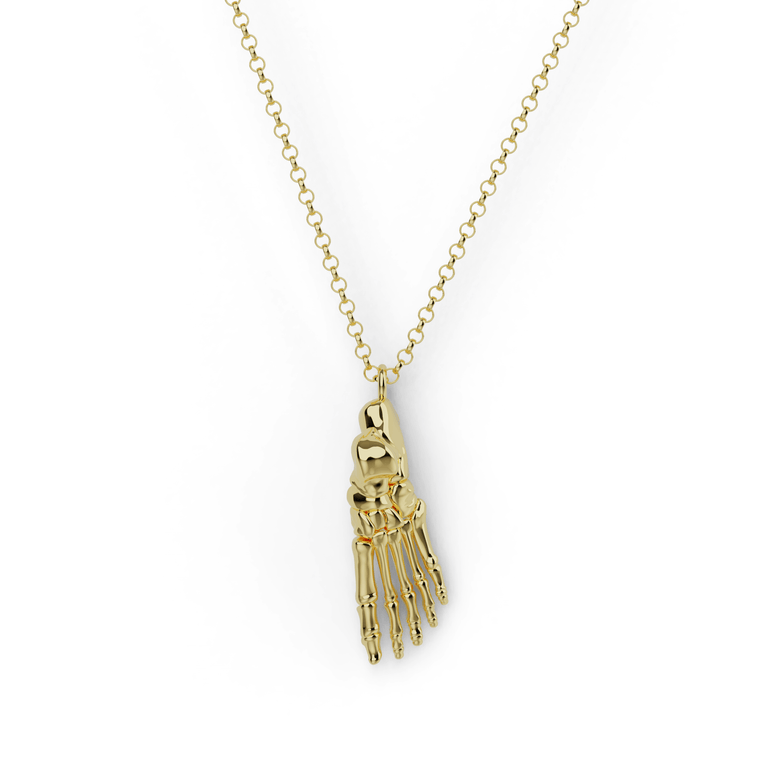 Gold vermeil foot anatomy necklace featuring a detailed skeletal structure of the foot, set against a white background.