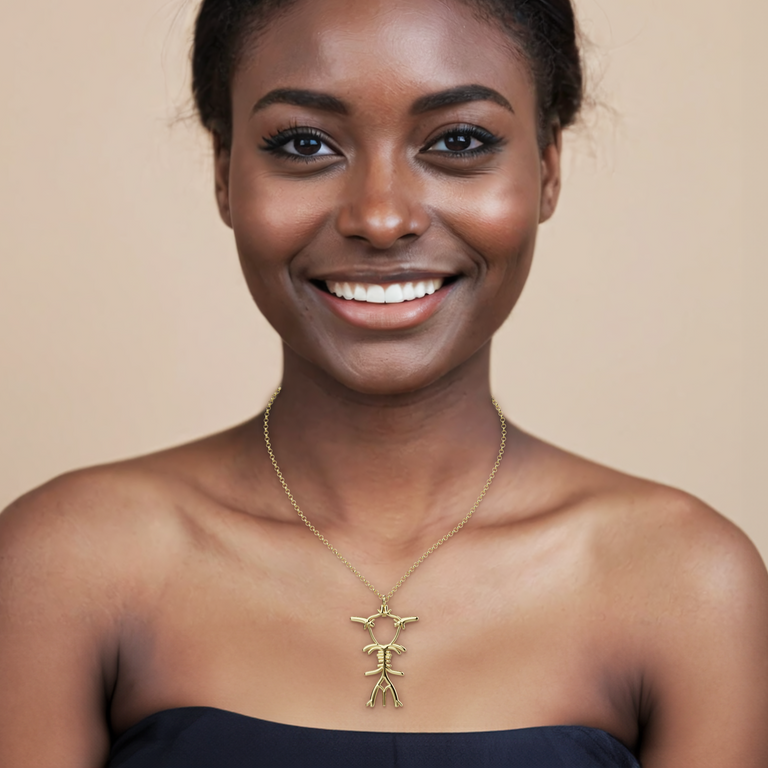 Model wearing the gold vermeil Circle of Willis Necklace, showcasing the brain-inspired piece that celebrates the network of blood vessels that keep us thinking.