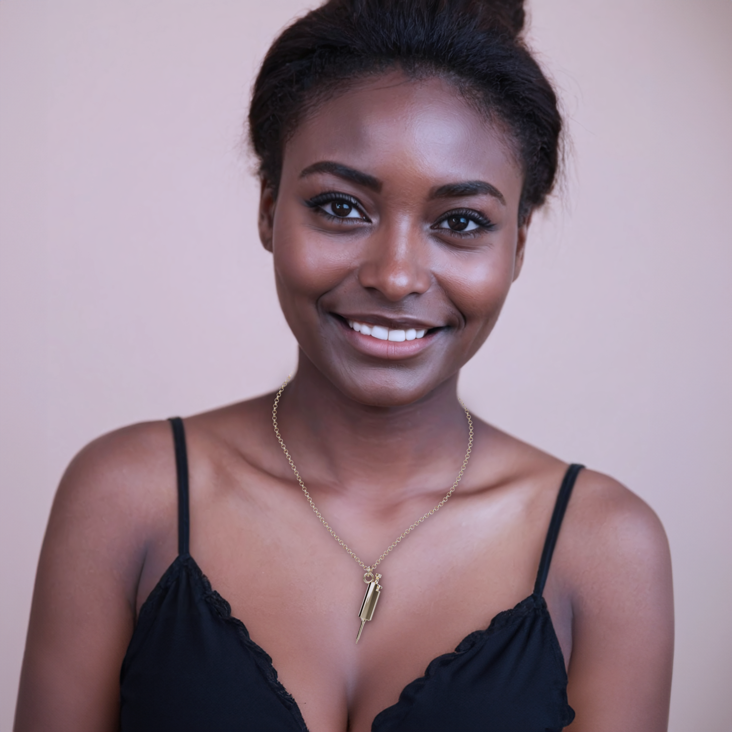 Close-up image of a gold vermeil pipette necklace on a model, highlighting its unique science-inspired design