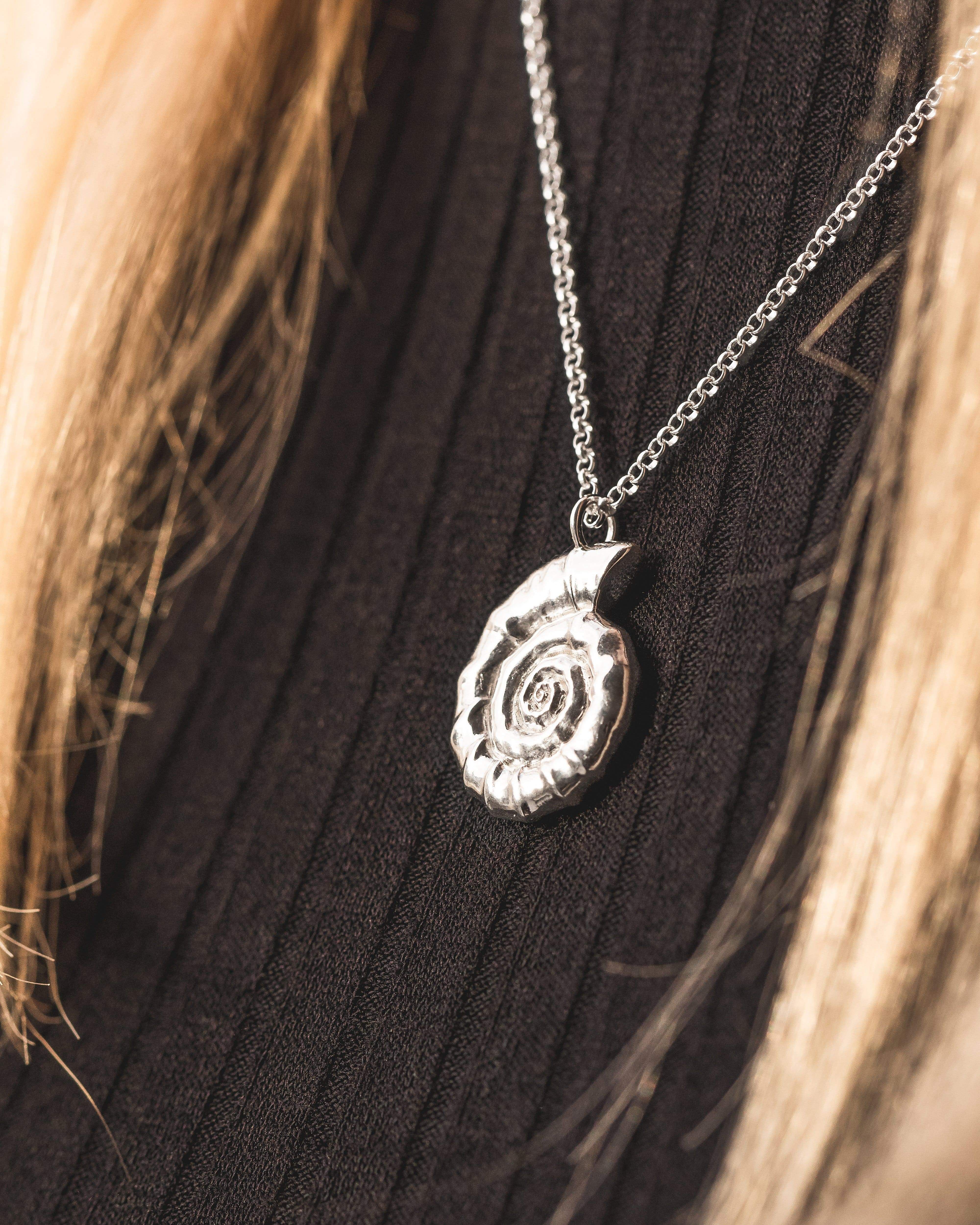 Ammonite Necklace in sterling silver, capturing the beauty of ancient marine fossils.